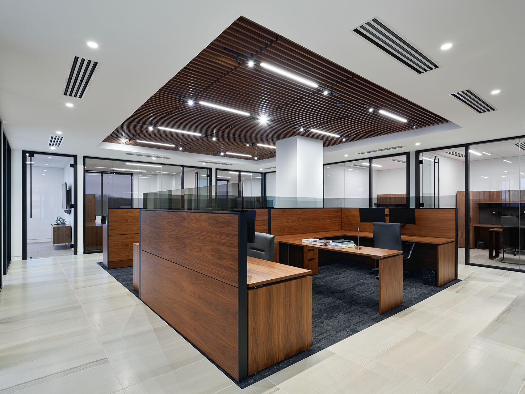 wide shot of working stations with overhead wood detailing in the lighting
