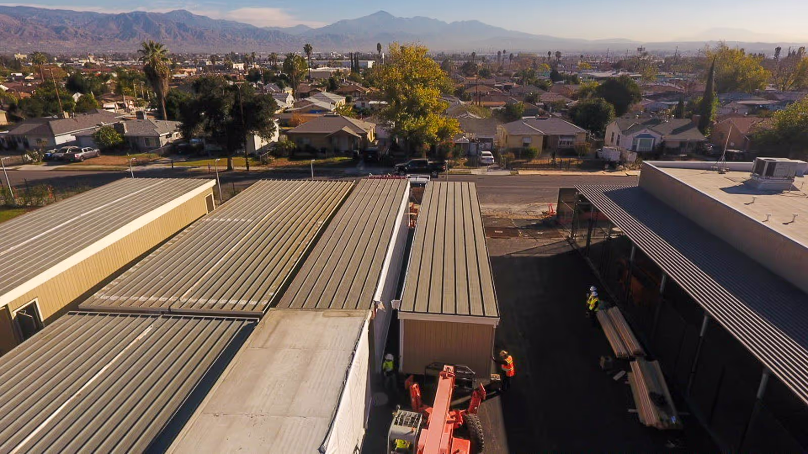 Aerial view of newly installed metal roofing on a modular campus