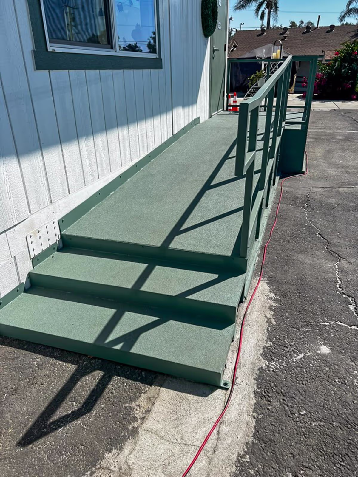 Long ADA-compliant ramp leading to a modular building entrance