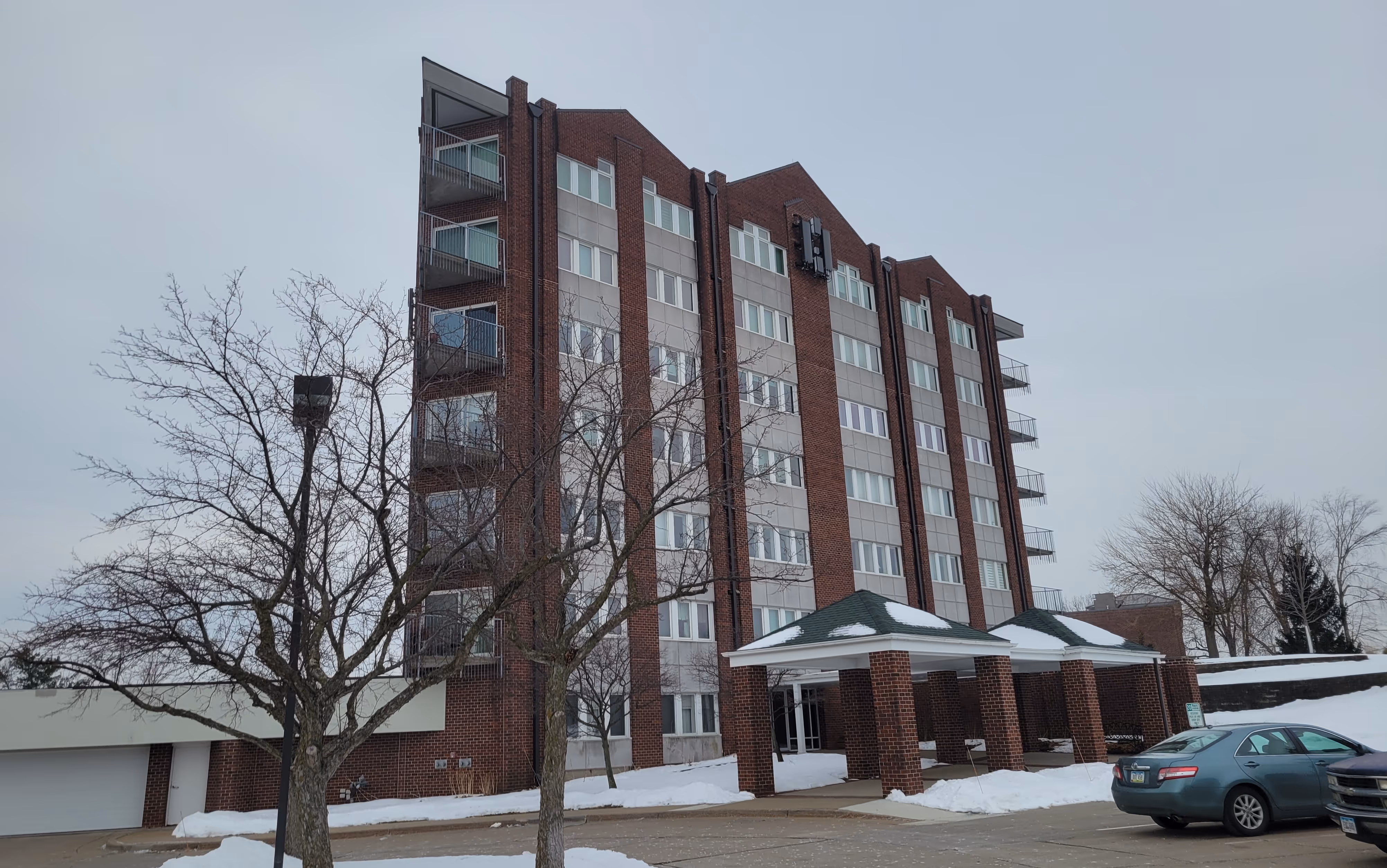 Fraco ACT-8 mast climbing platform installed on a commercial building for a cell tower upgrade project in Cedar Rapids, Iowa