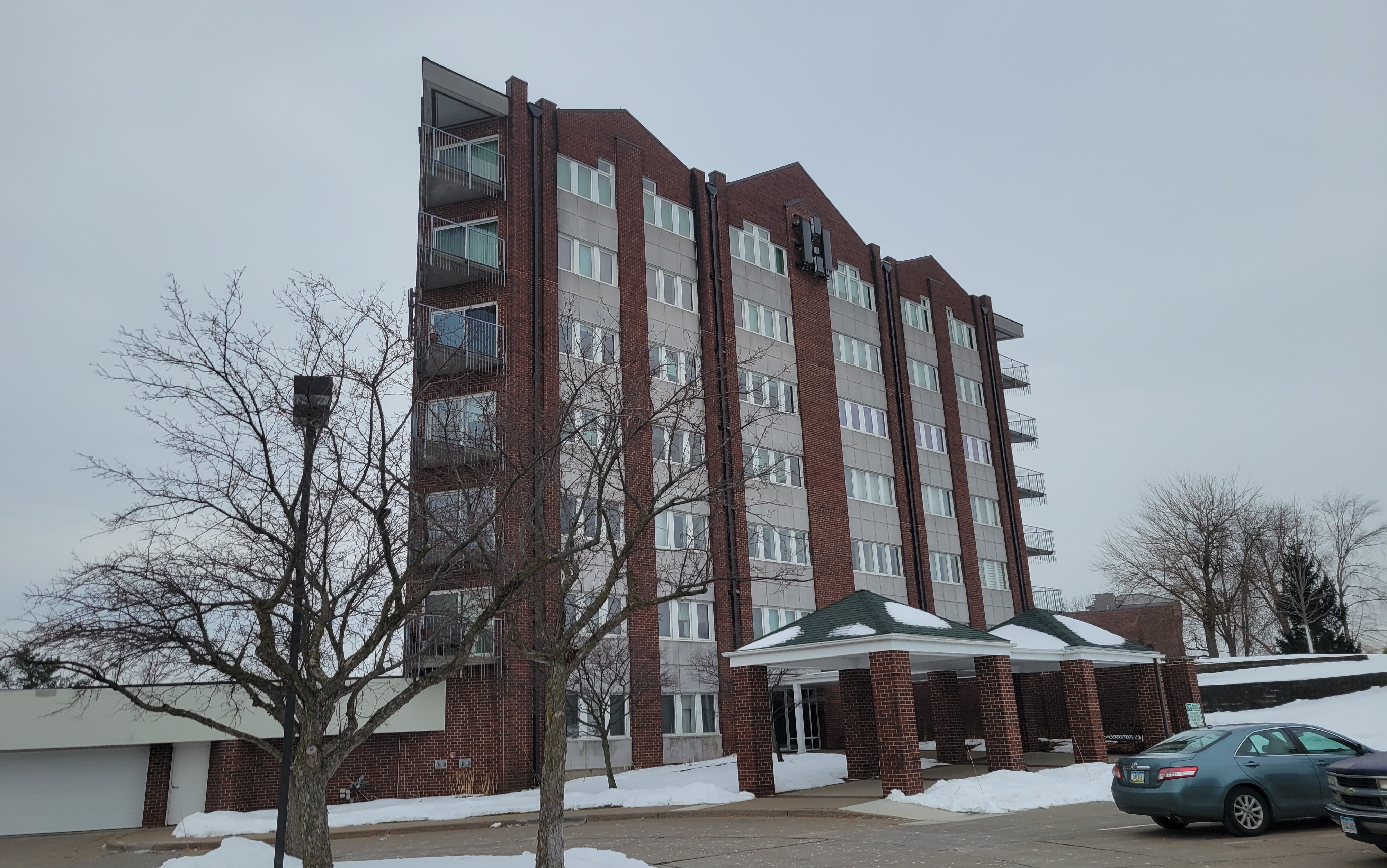 Fraco ACT-8 mast climbing platform installed on a commercial building for a cell tower upgrade project in Cedar Rapids, Iowa
