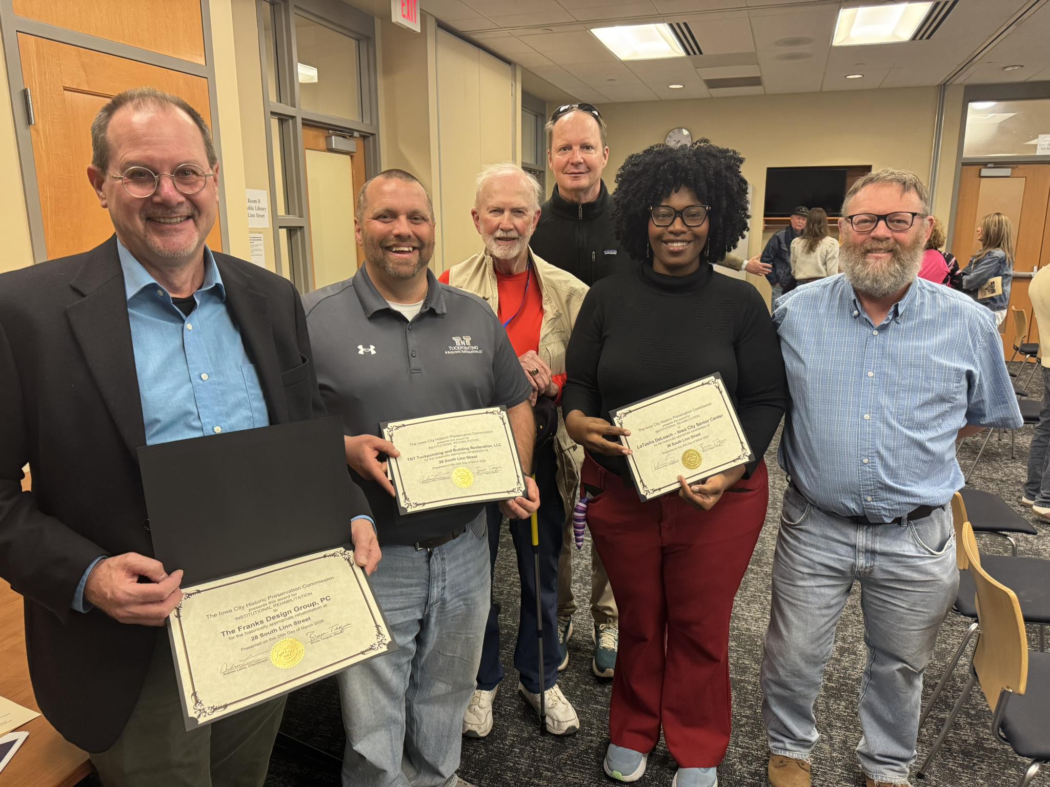  Iowa City Senior Center Project Team holding their award.
