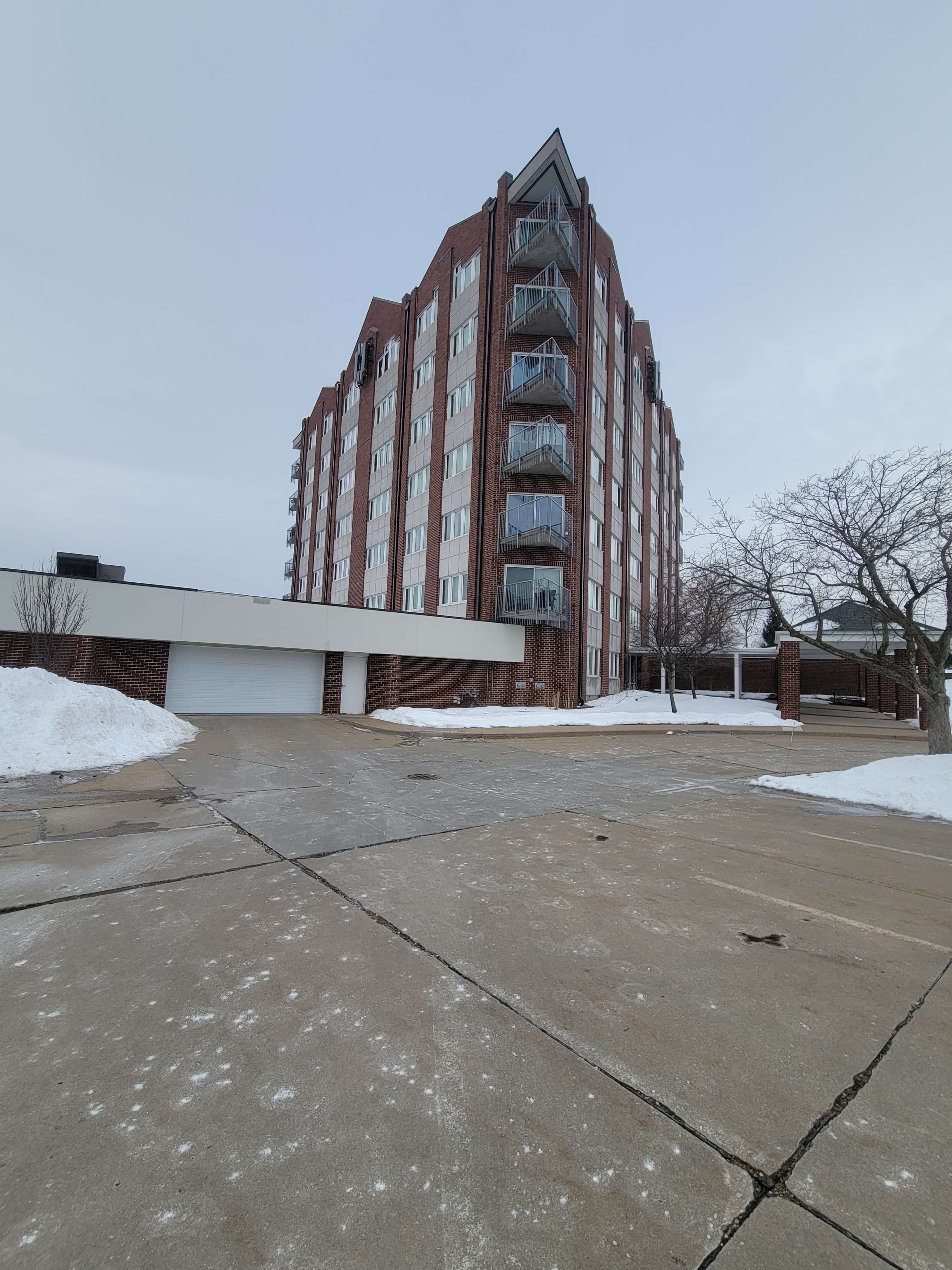 Sloped roofing and site constraints requiring engineered access at 111 Cottage Grove, Cedar Rapids