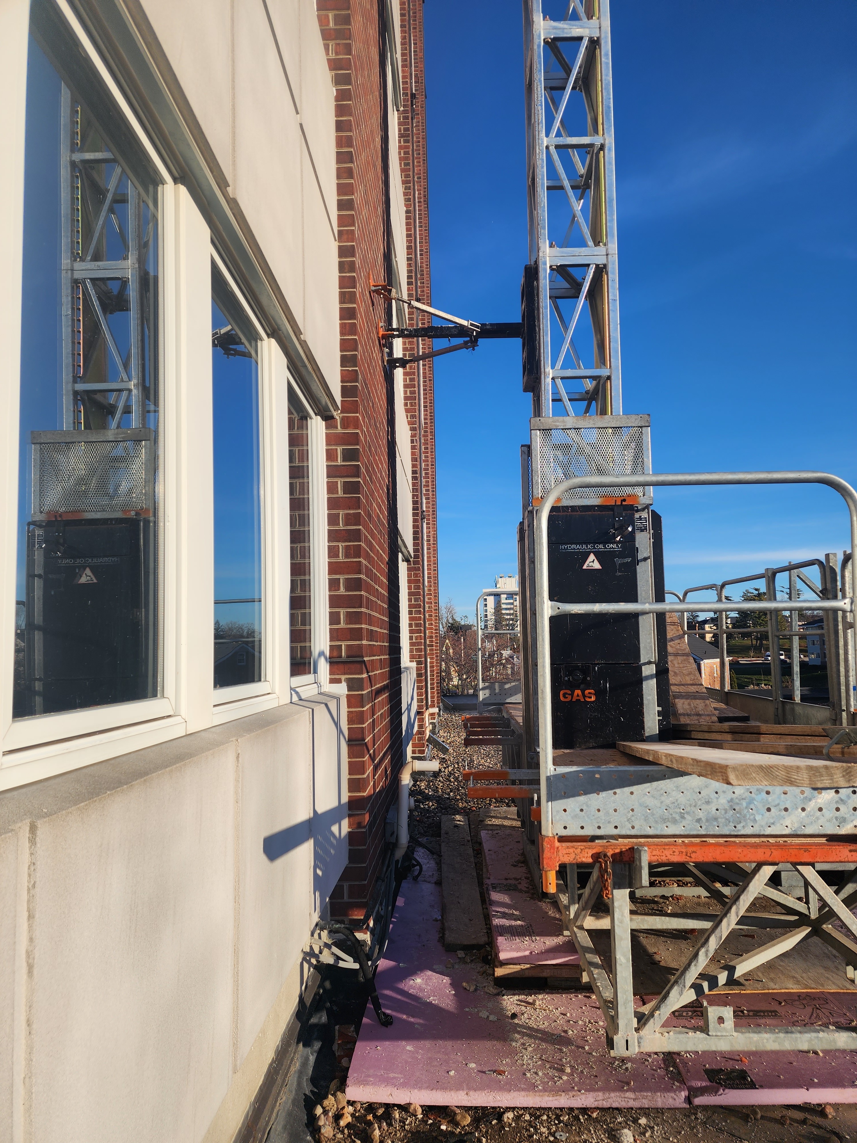 High-elevation masonry deterioration above parking garage at 111 Cottage Grove condominium
