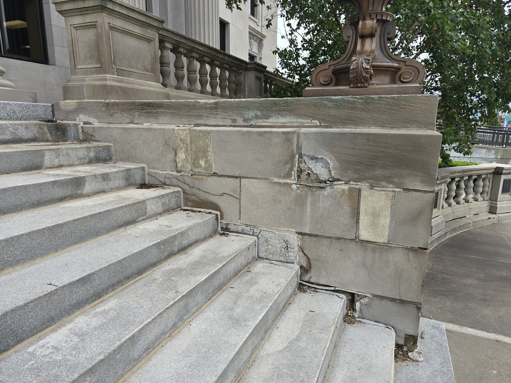 Deteriorated limestone at Linn County Courthouse plaza requiring full restoration