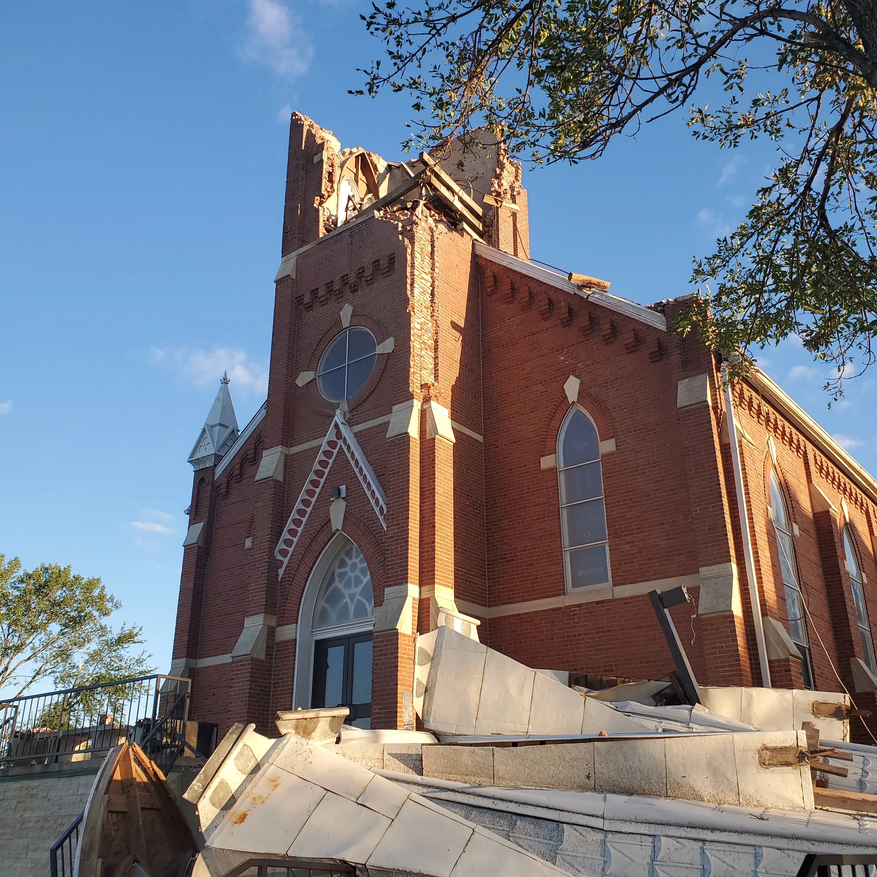 Structural damage and debris after bell tower collapse at St. Michael Catholic Church, Norway, Iowa