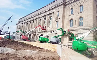 Restored stone and tuckpointed brick facade at Des Moines City Hall after TNT Tuckpointing work