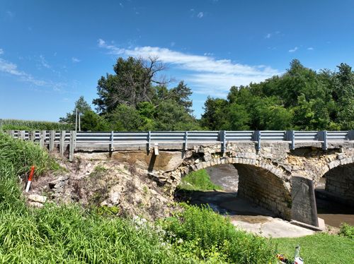 Ely's Stone Bridge, an 1893 three-arch limestone bridge over Deer Creek outside Monticello in Jones County, Iowa.
