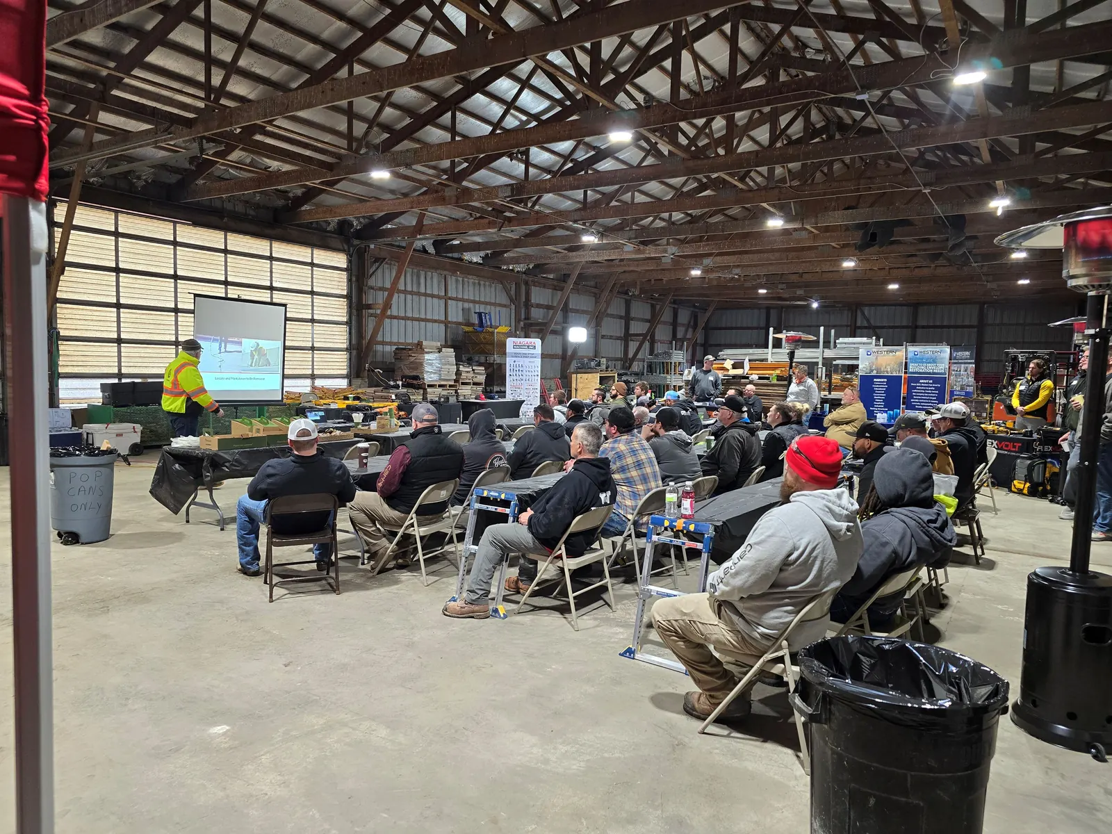 Matt Hansen of Euclid Chemical presenting to a crowd at the Iowa/Illinois ICRI Concrete Surface Preparation Seminar, hosted at the TNT Tuckpointing shop in Stockton, Iowa.