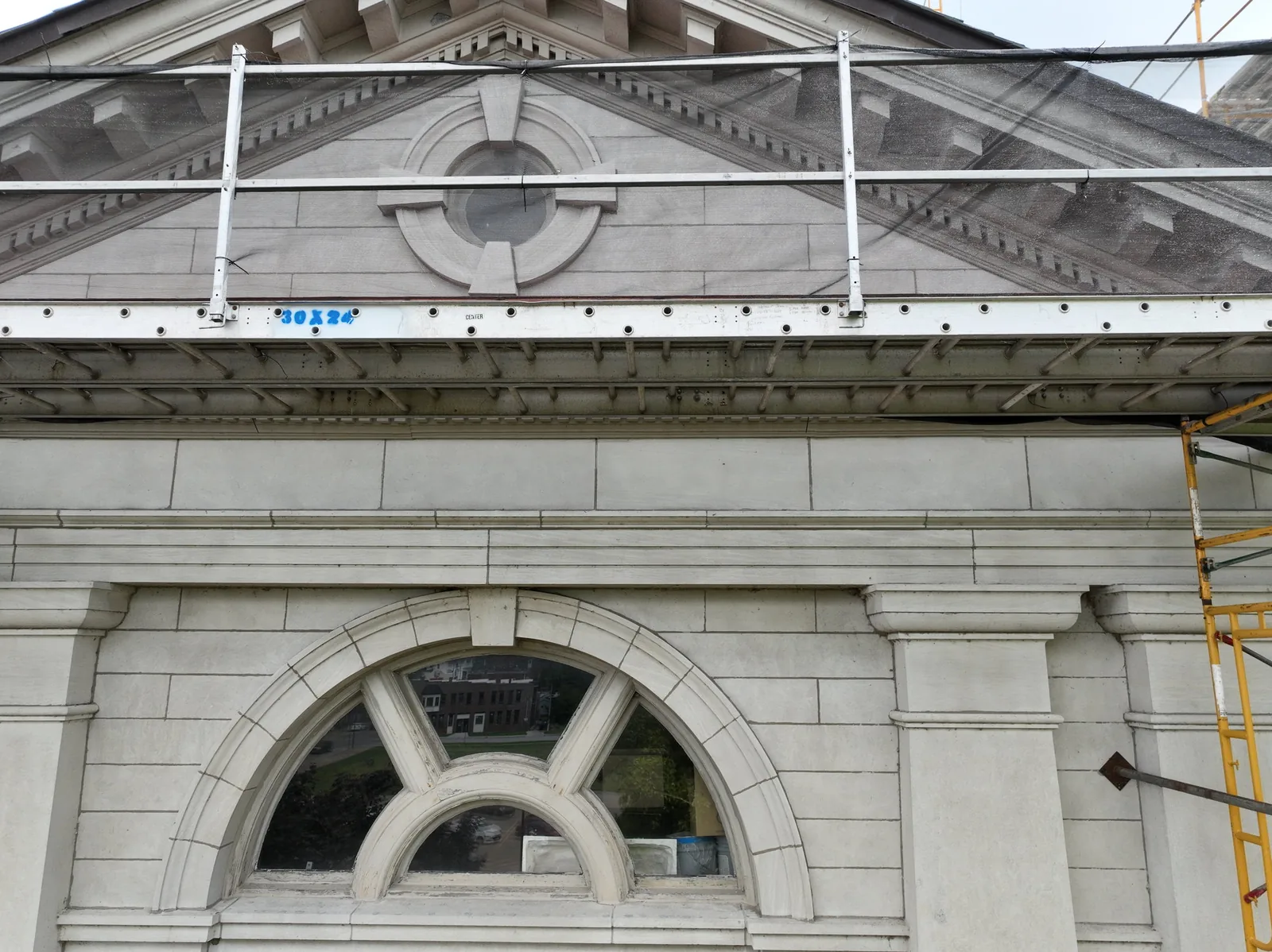 Arched stone window on the Muscatine County Courthouse, seen by drone in August 2024