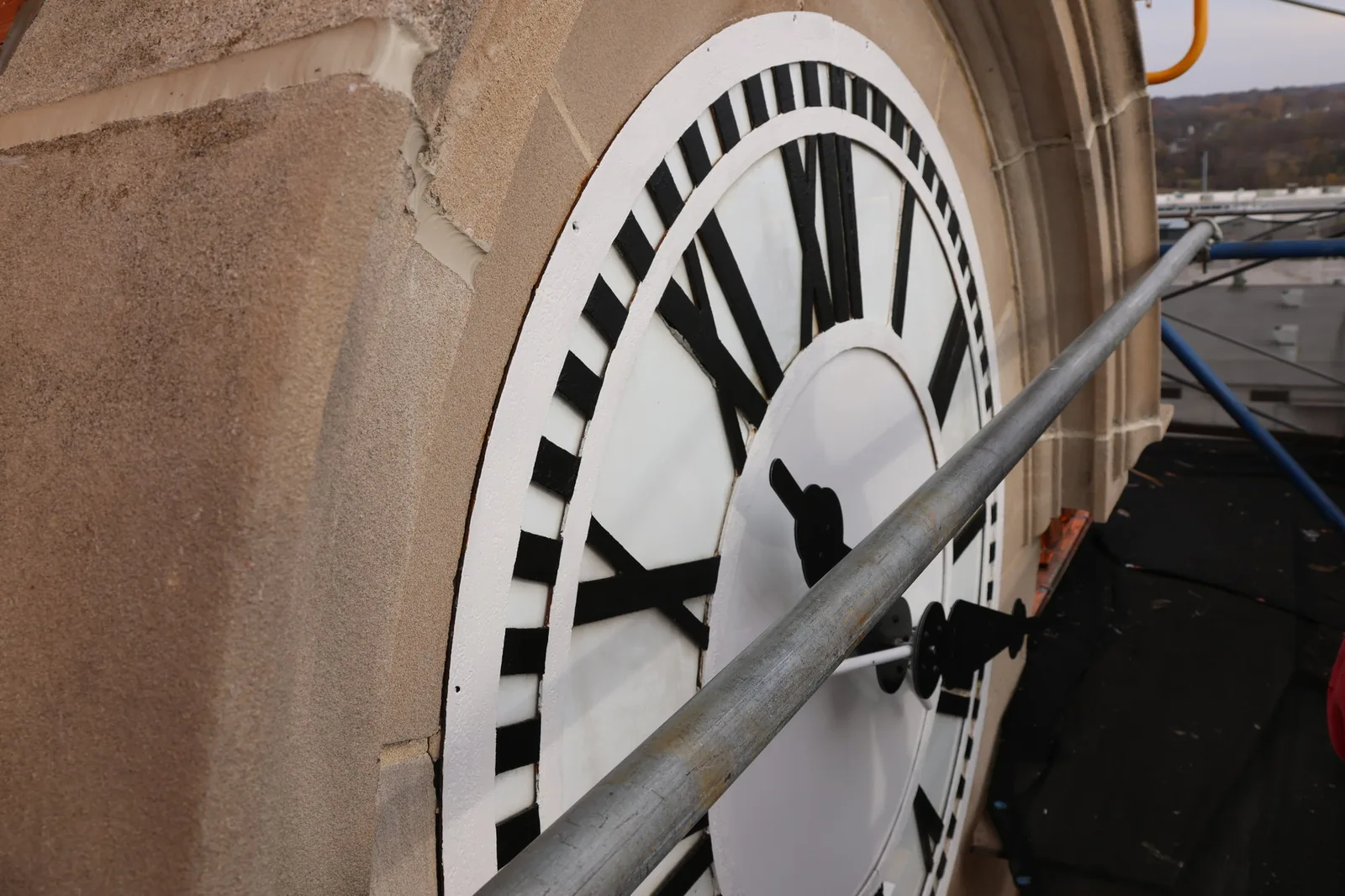 Close-up of a clock face on the Muscatine County Courthouse tower during TNT's 2024 repairs