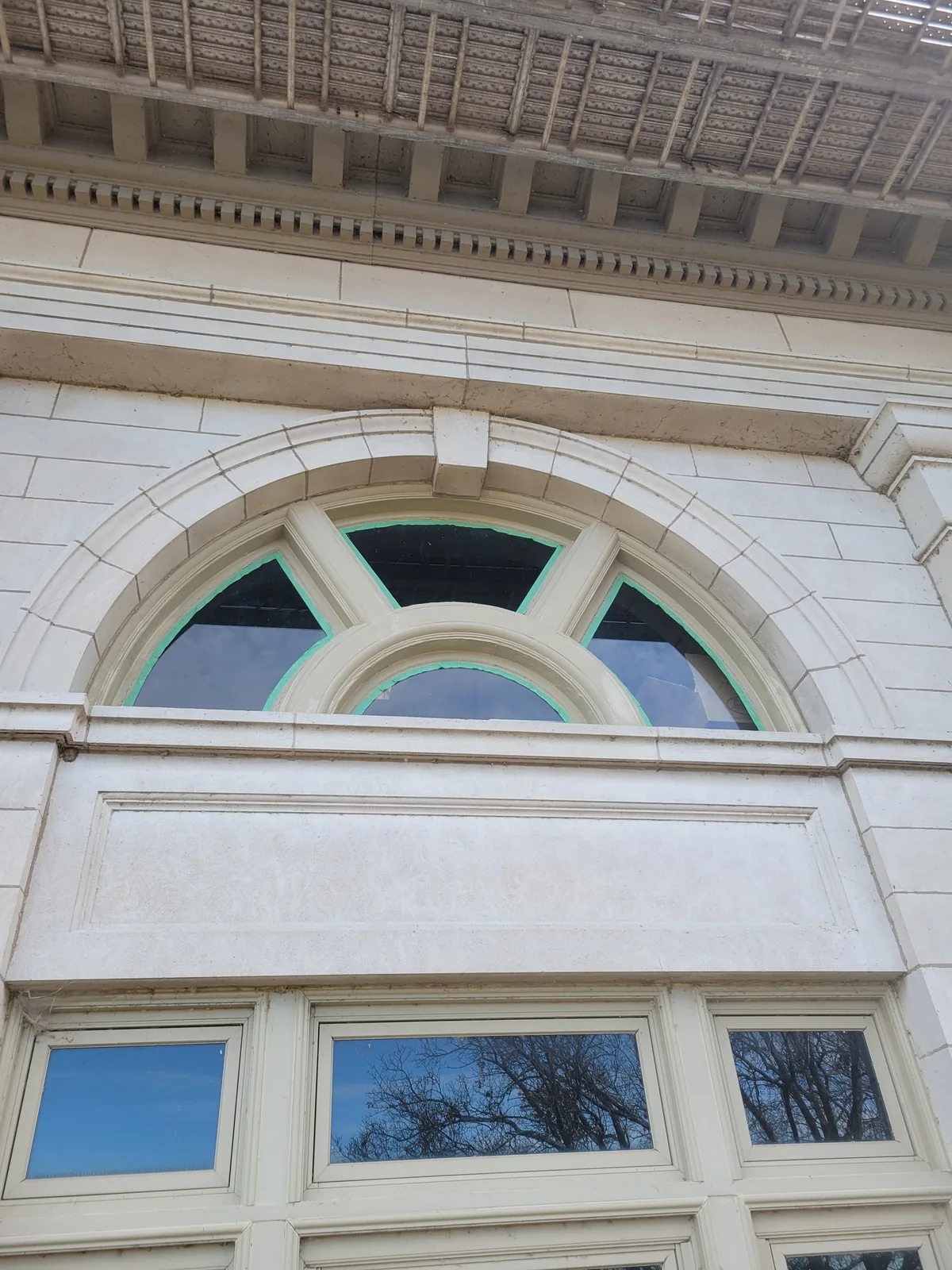 Painted and recaulked arched window on the Muscatine County Courthouse, December 2024