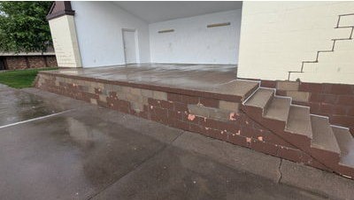 Completed block retaining wall and coated steps at the West Park Bandshell in Durant, Iowa