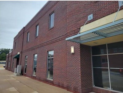 Two-story red brick facade of Green Belt Bank & Trust in Iowa Falls, Iowa