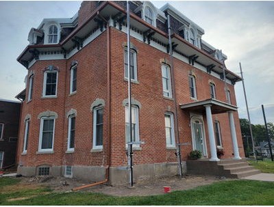 Historic Italianate brick Palmer House in Davenport, Iowa, after stone repair and tuckpointing