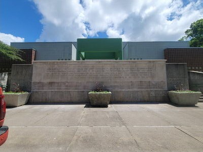Ornate stone entry pillars at the Ashworth pool in Des Moines, Iowa, during masonry restoration
