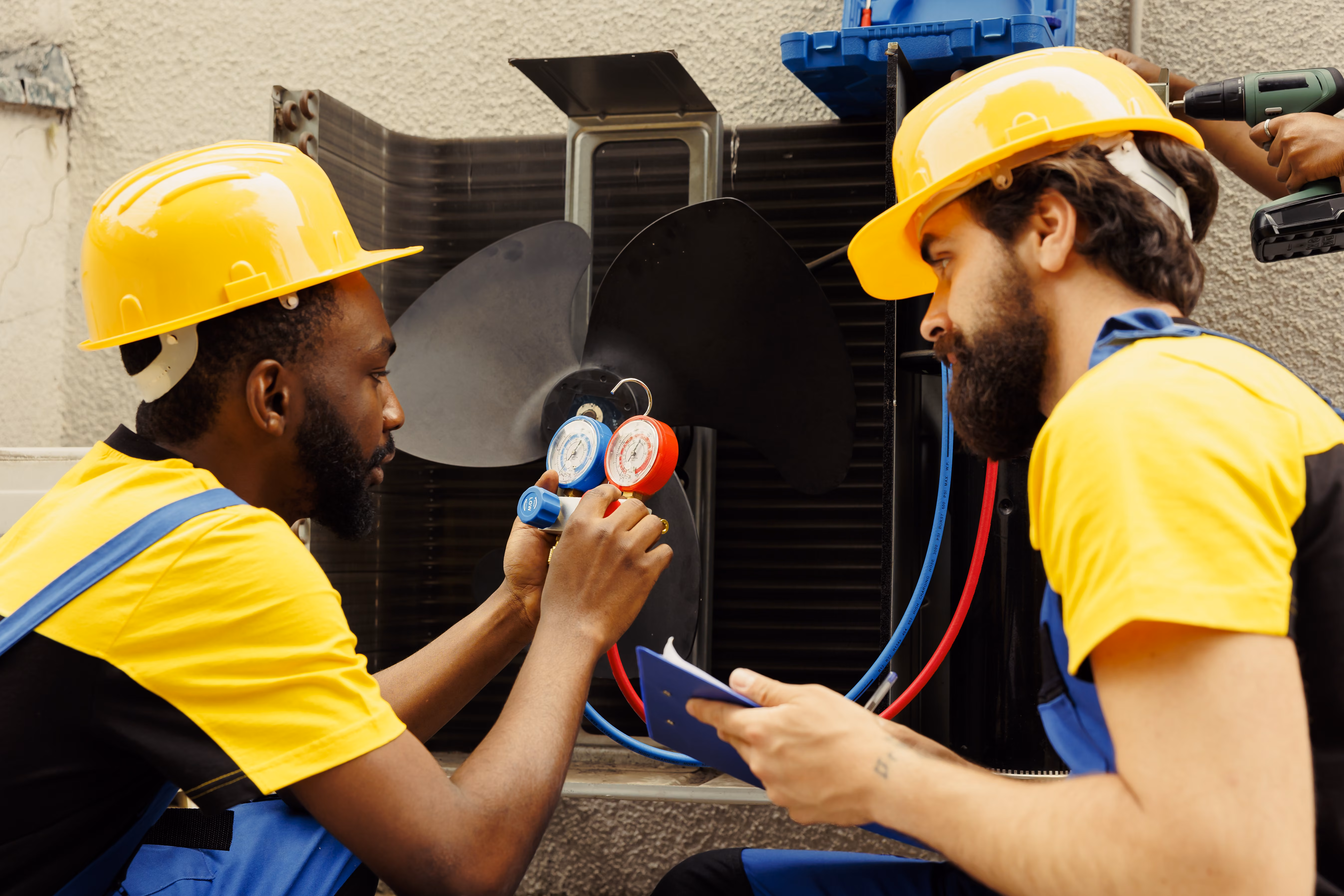 HVAC contractor servicing rooftop unit — AOR construction insurance program.