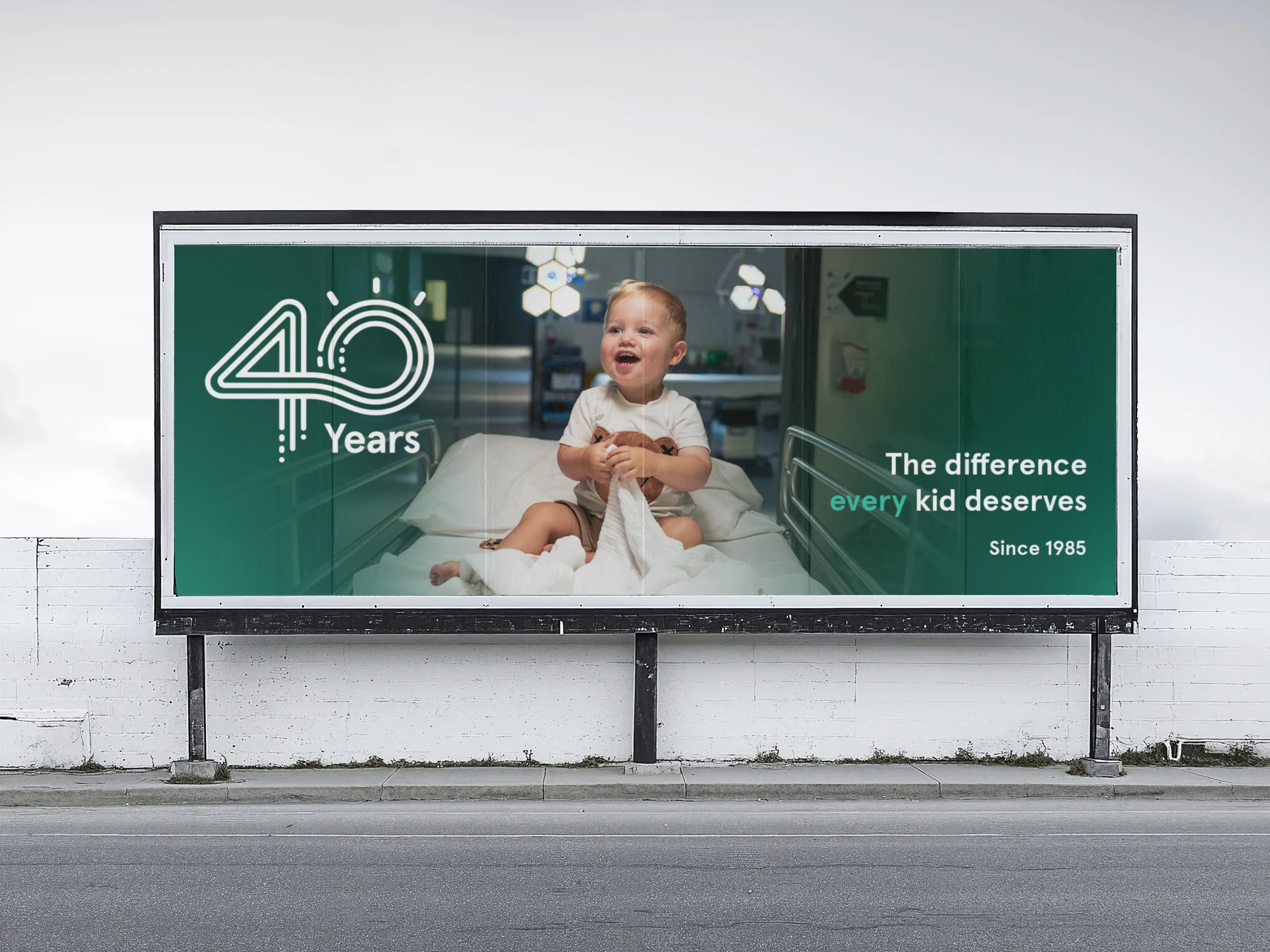 A custom design billboard advertisement that shows a the Children's Hospital Foundation 40 year anniversary logo.