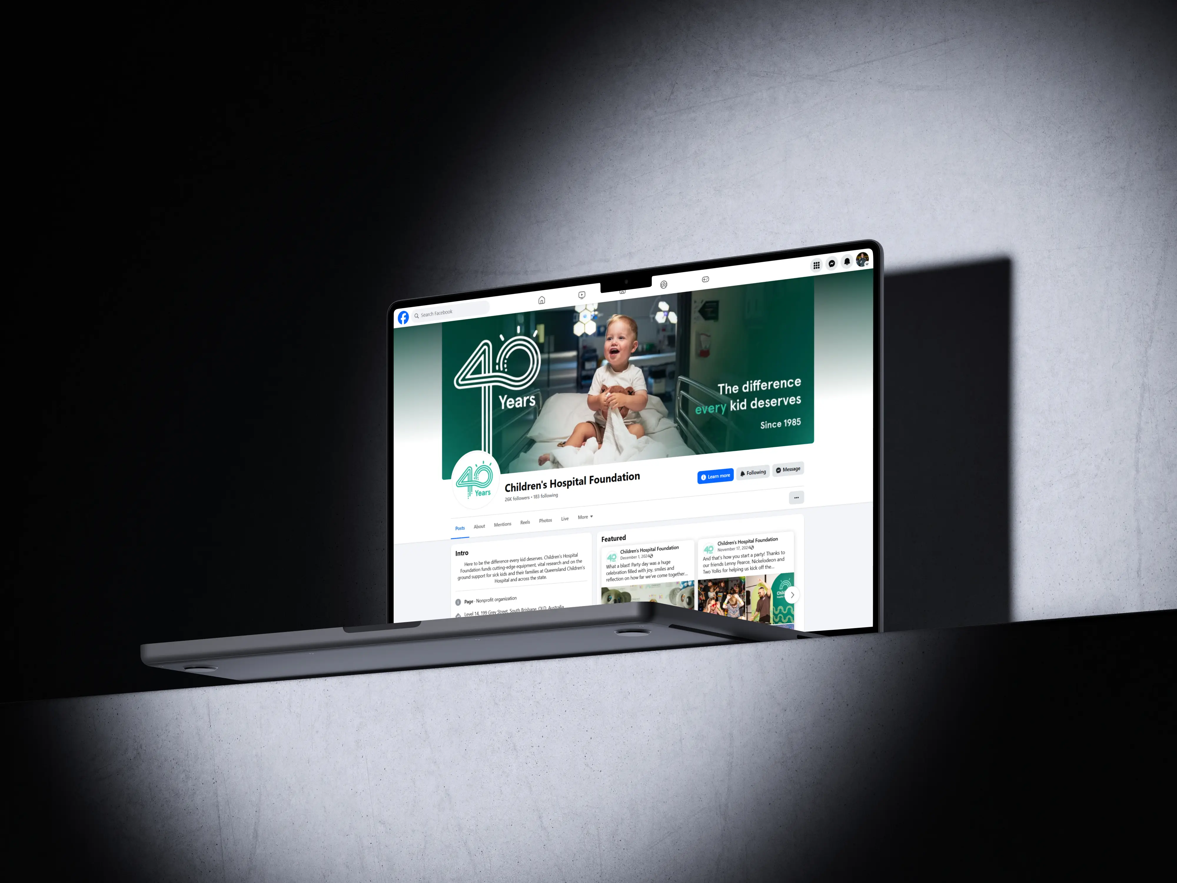 A laptop displaying updated social media profile for the Children's Hospital Foundation, showcasing the 40 year anniversary logo