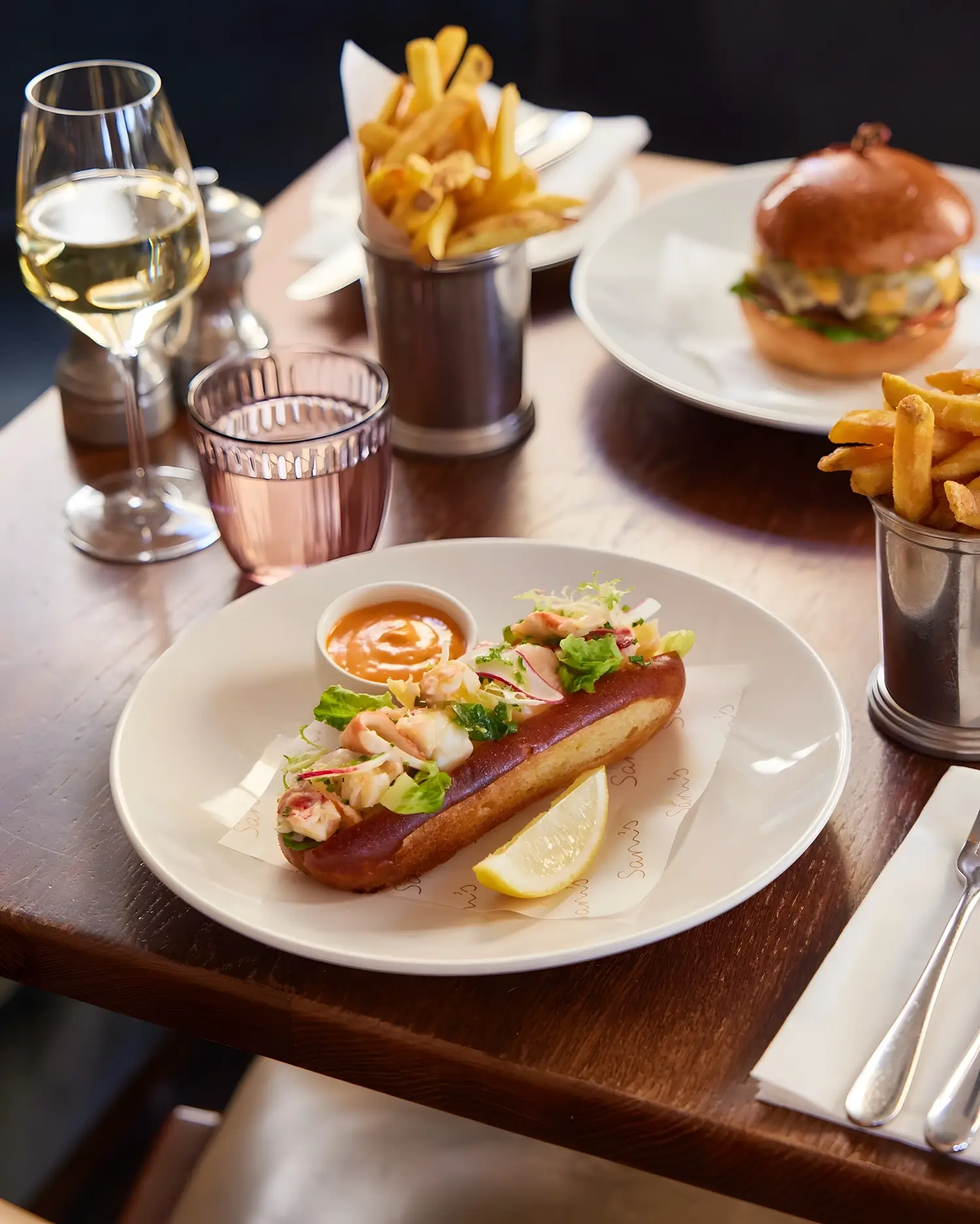 British native lobster roll served at Sam’s Riverside in Hammersmith with chips and wine
