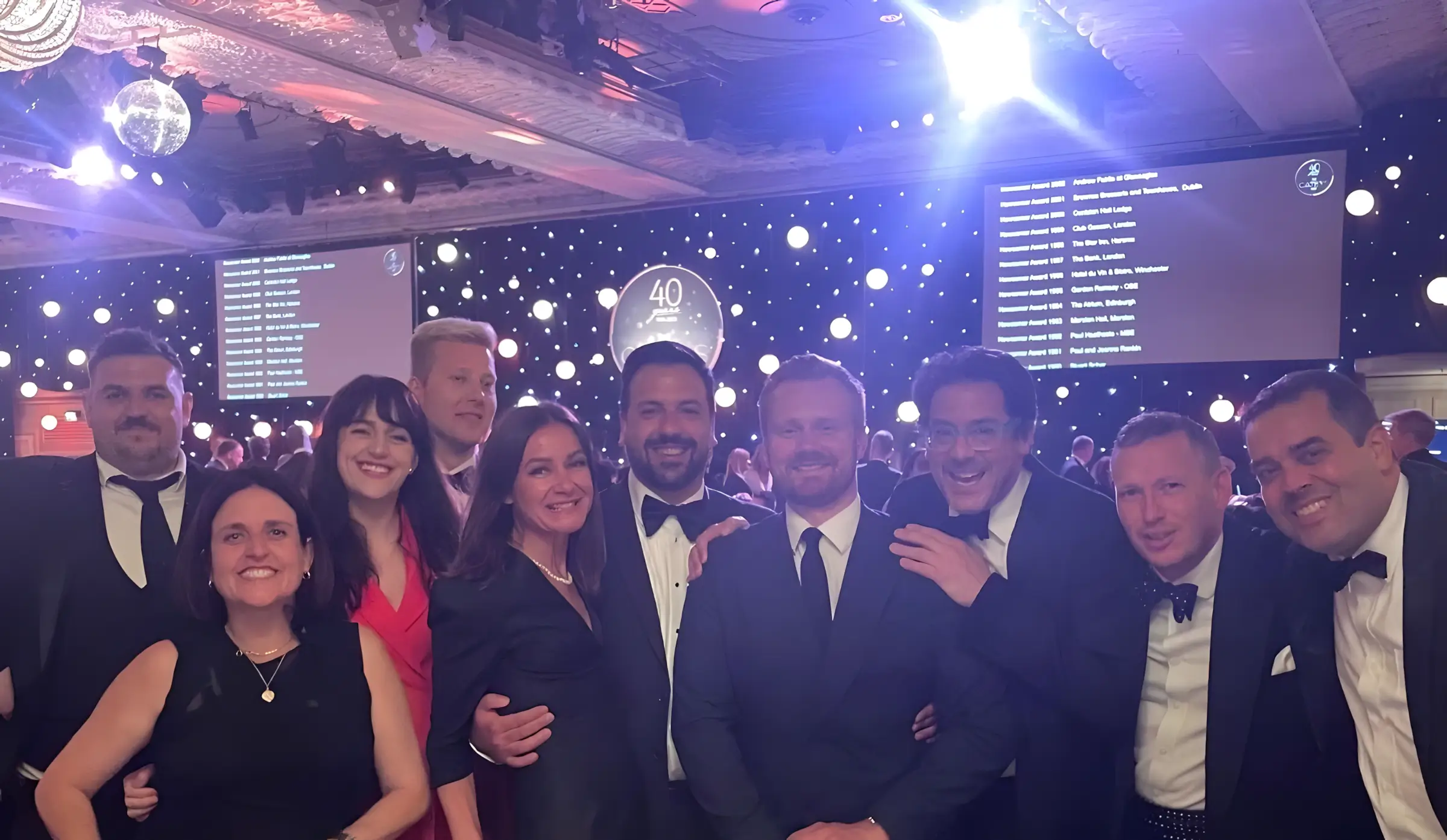 Sam's restaurant team celebrating together in 2026