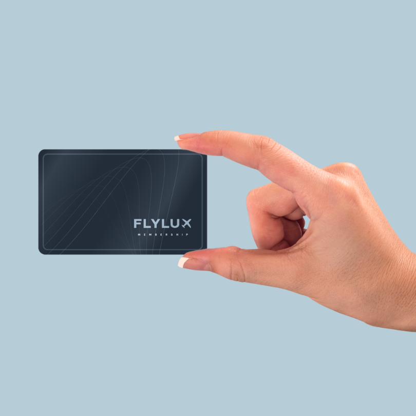 Someone is choosing a flight option in the Flylux portal