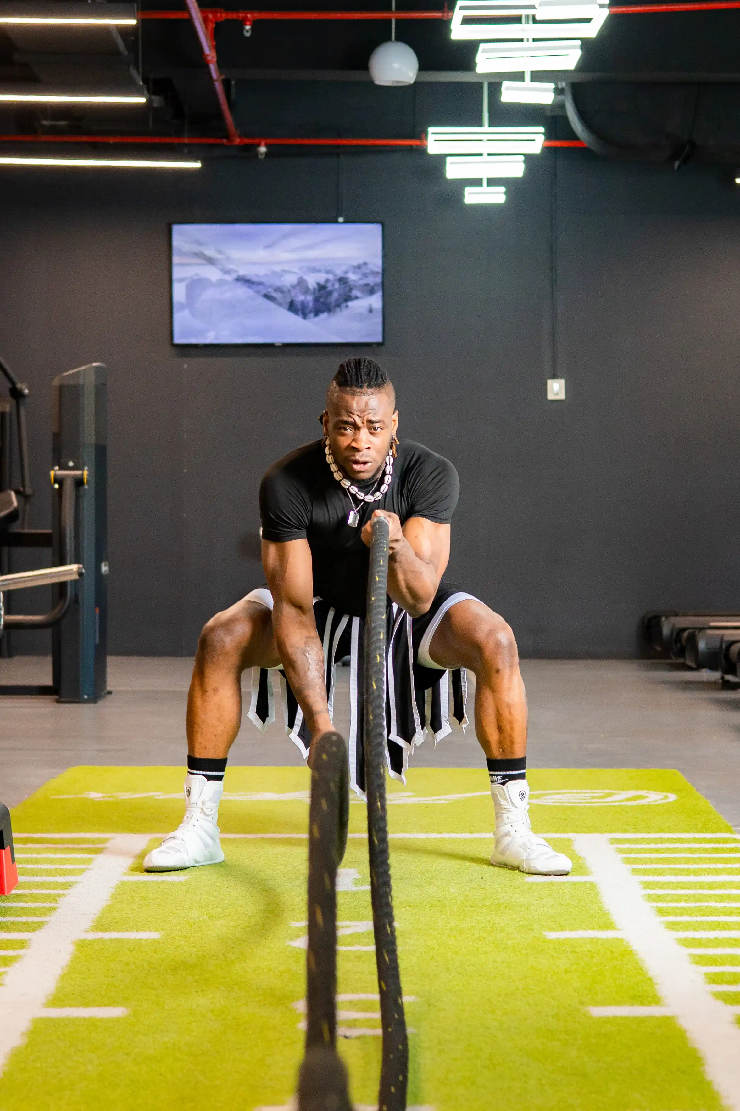 Coach using weight rope