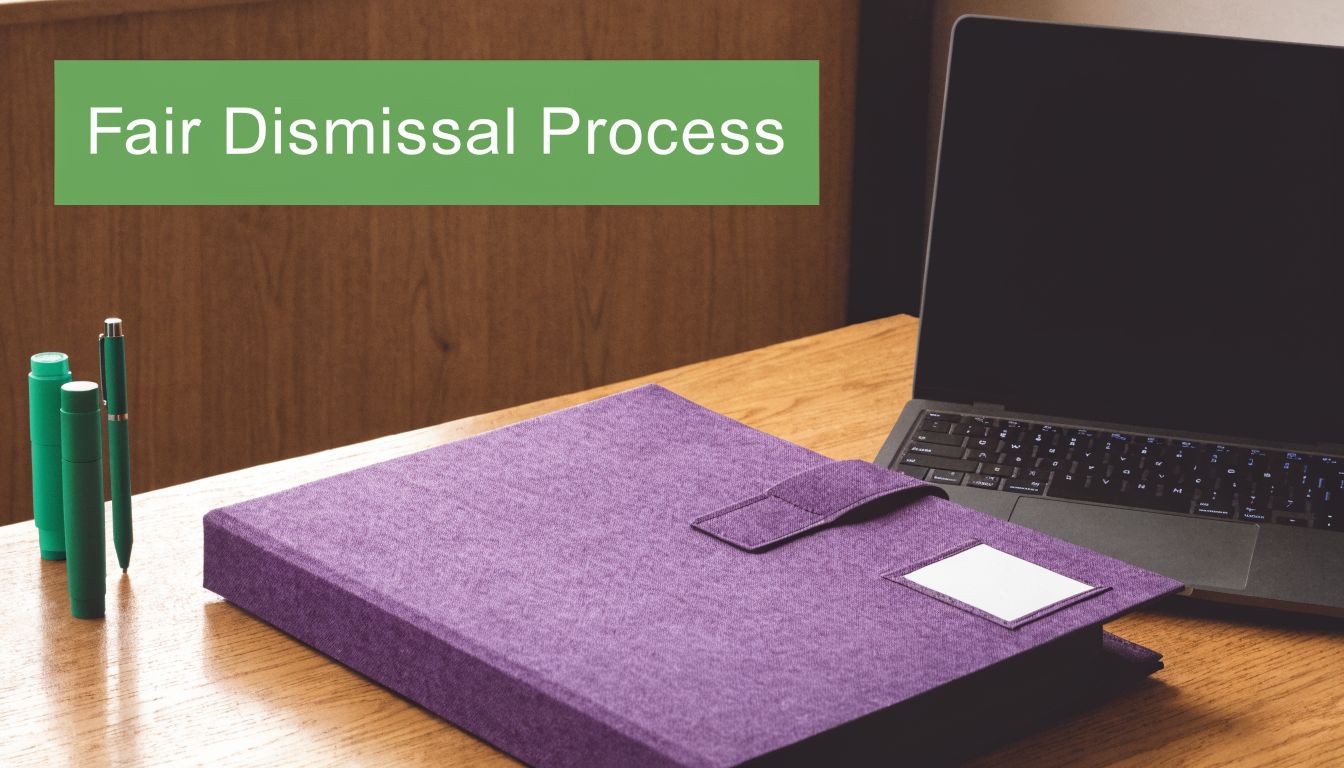 A purple binder and laptop on a wooden desk, symbolizing professional human resources document preparation.