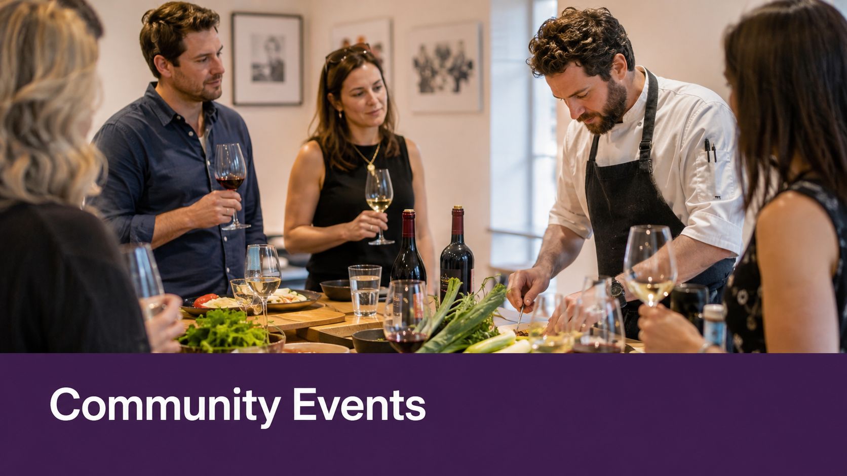 A professional chef preparing food while guests enjoy wine at an interactive community culinary workshop event.