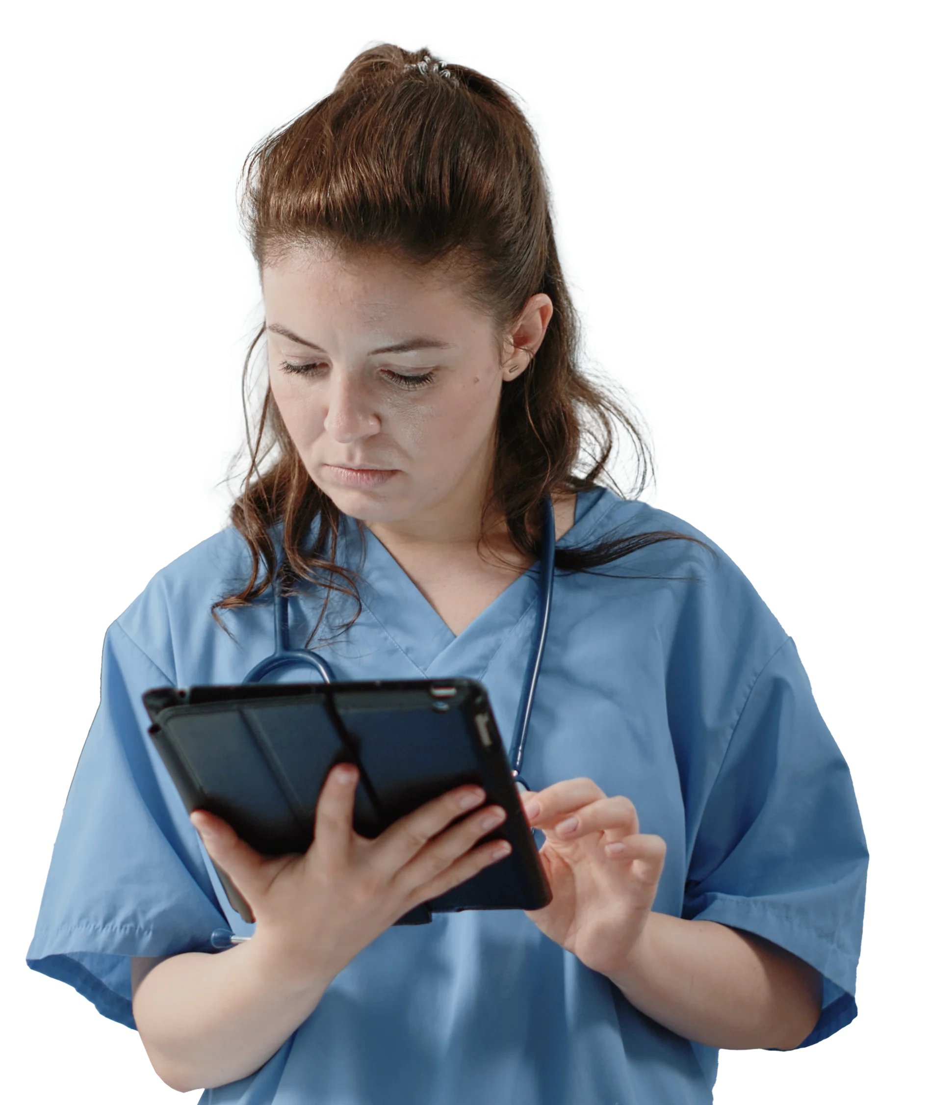 A woman in scrubs is looking at a tablet.