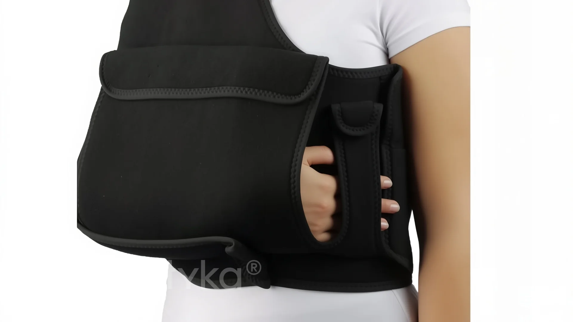 A woman wearing a black back support device.