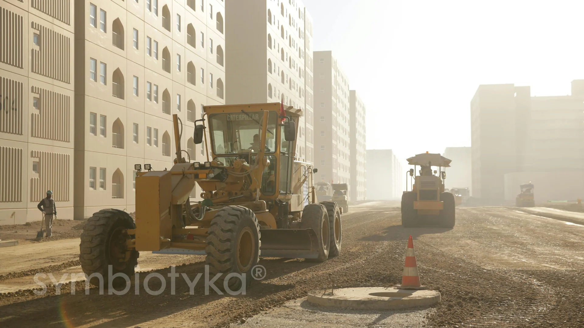 A bulldozer and a tractor on a construction site.