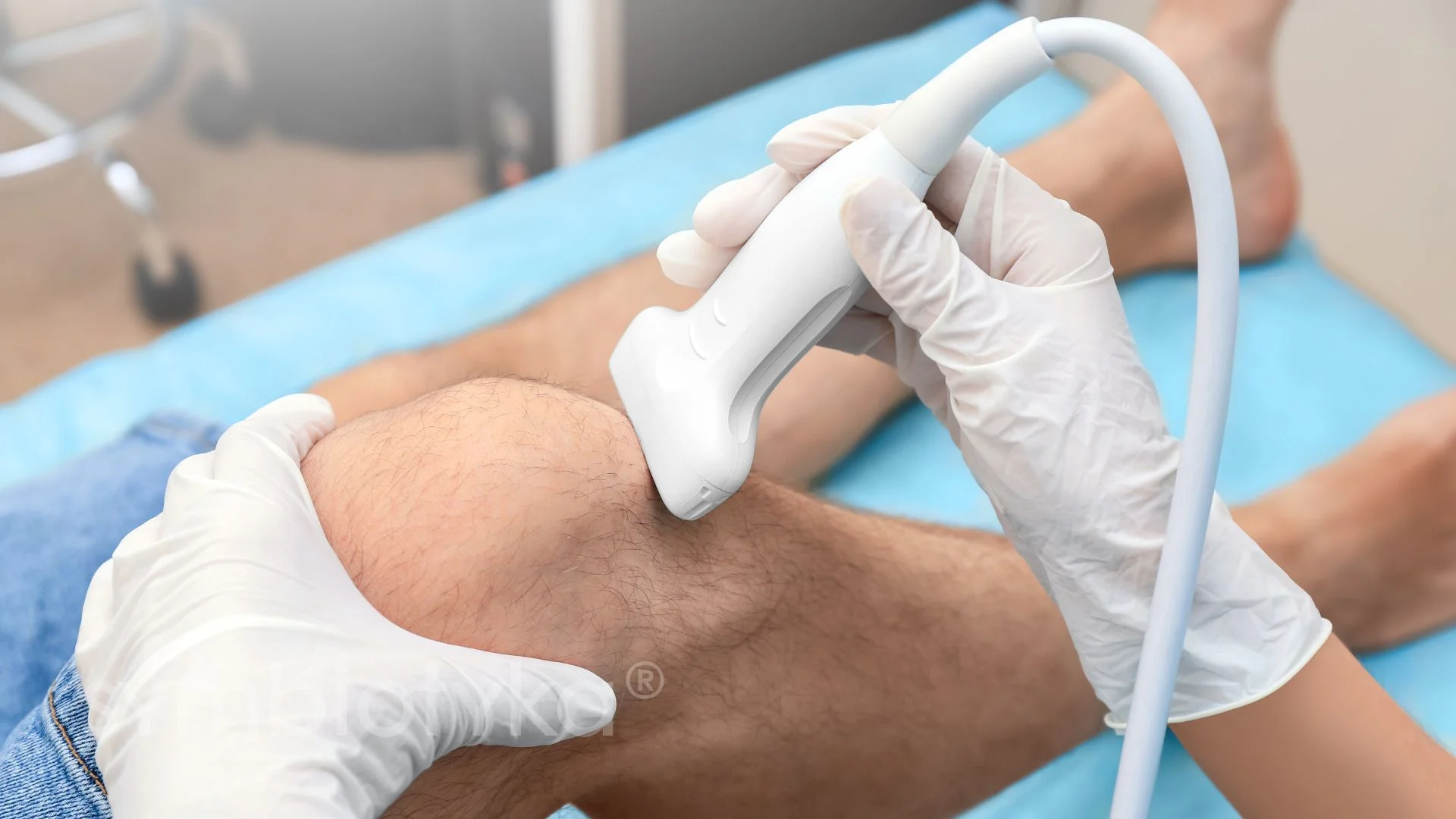 A person with an iv hooked up to his leg.