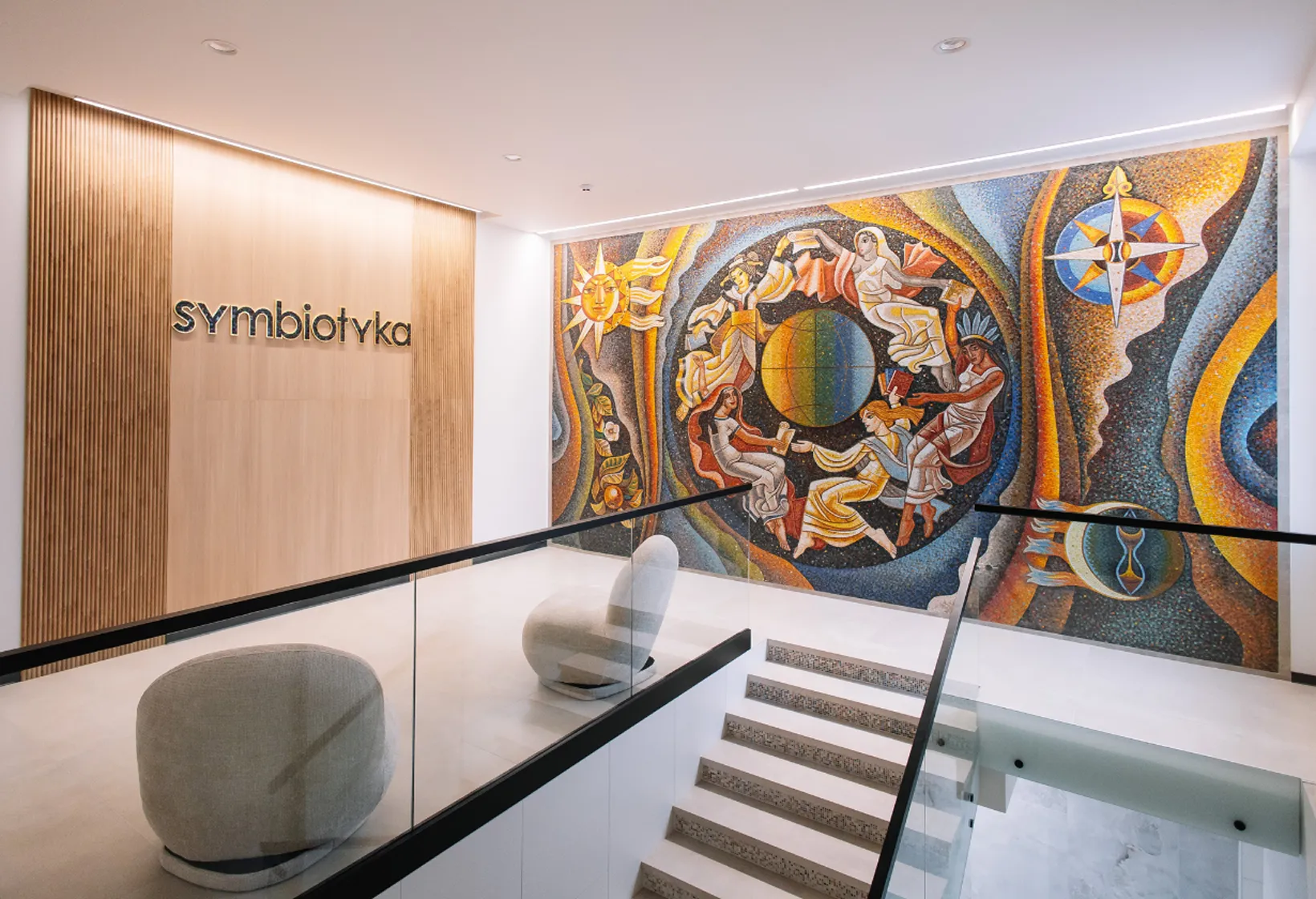 A staircase with a painting on the wall.