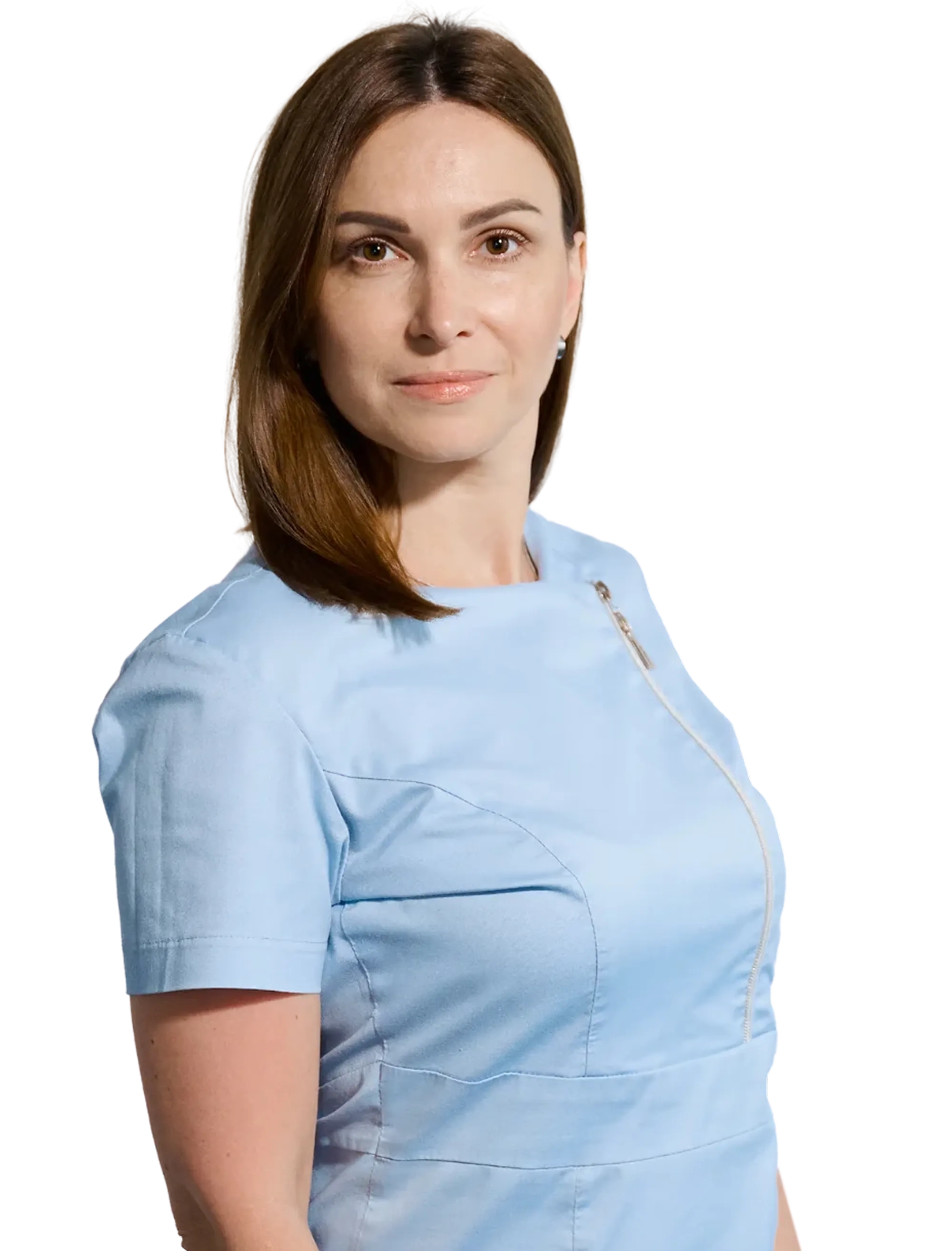 Woman with medium-length brown hair wearing a light blue top with a diagonal zipper, looking at the camera.