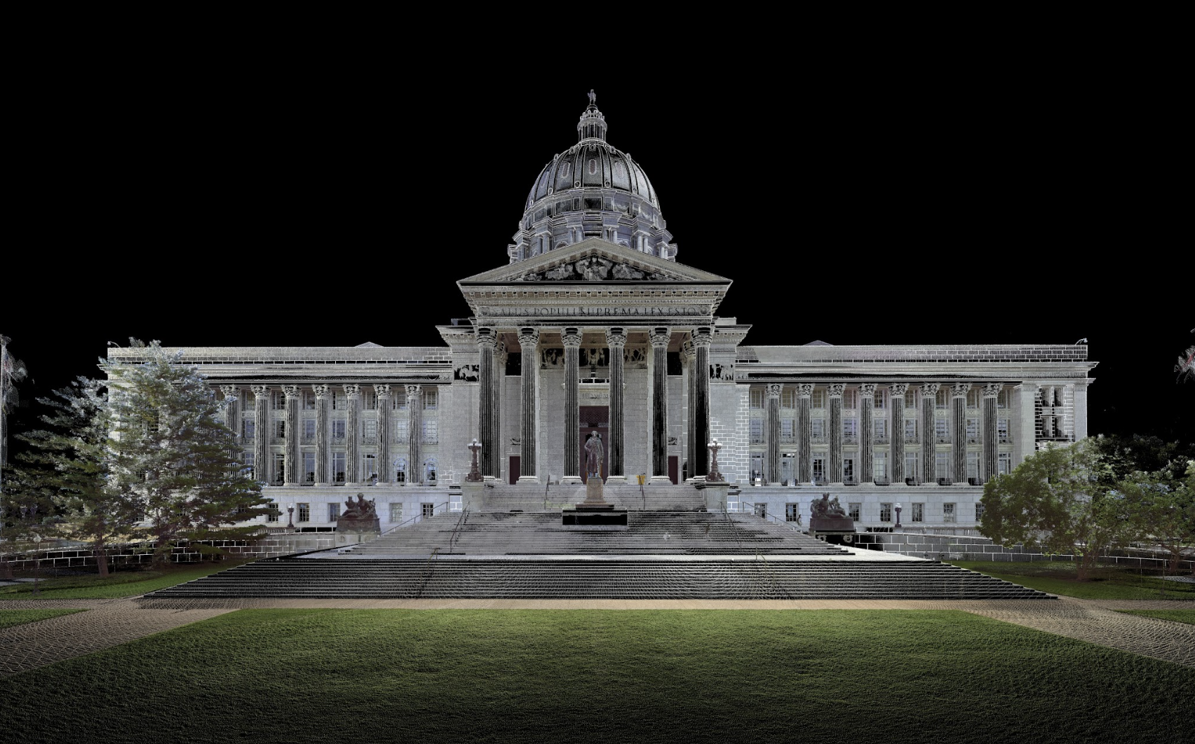 The state capitol building illuminated at night, showcasing its architectural beauty against a dark sky.