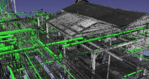 3D point cloud representation of an industrial facility with a sloped-roof building and multiple green pipelines running through and around it.