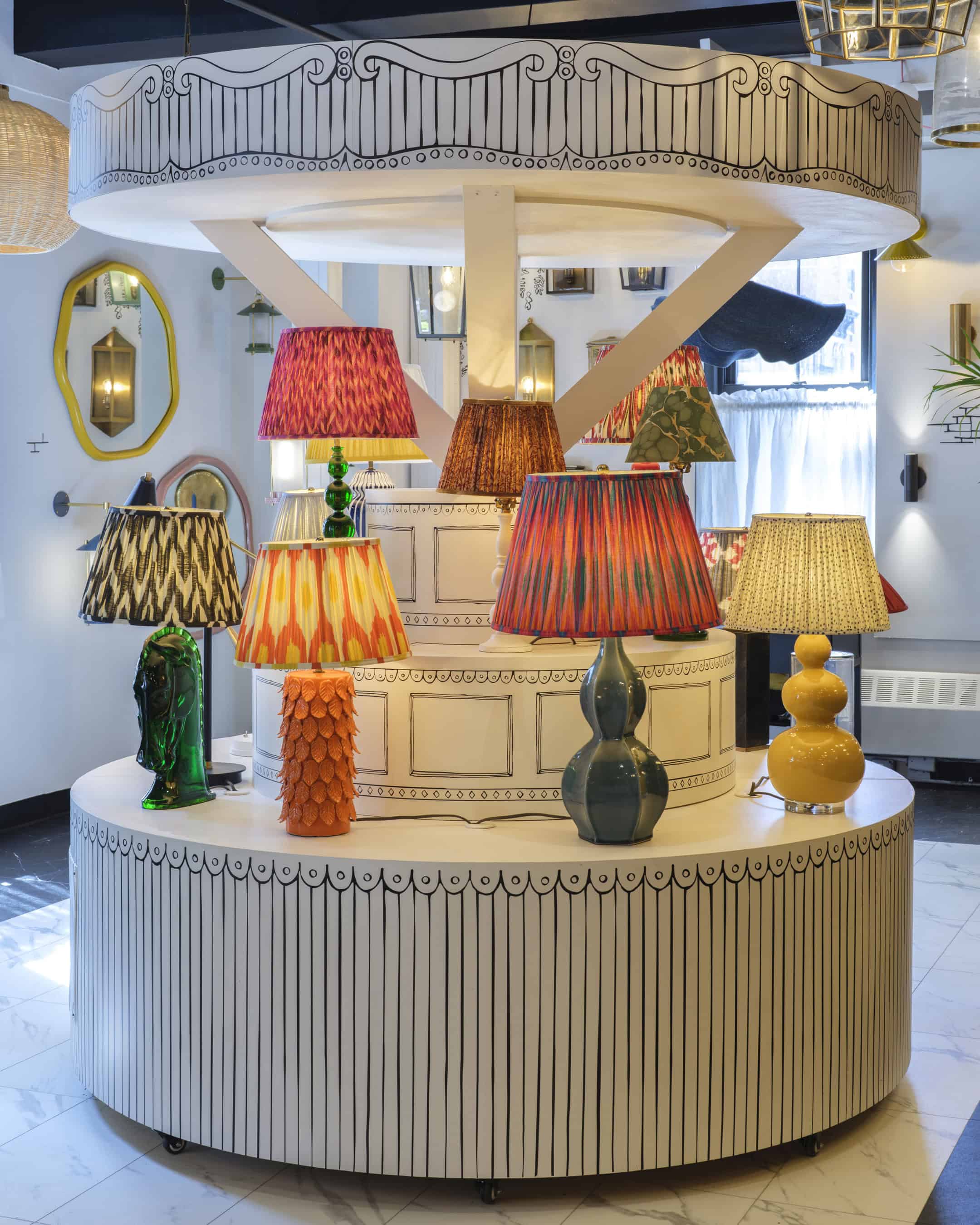 Global showroom and retail display design for Pooky lighting, created by Studio Adler with bold, playful illustrations.