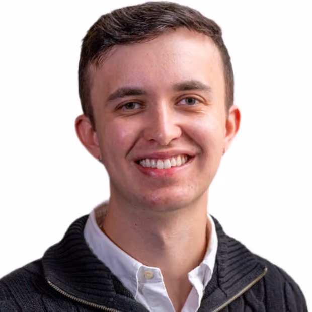 Portrait of man with brown hair smiling