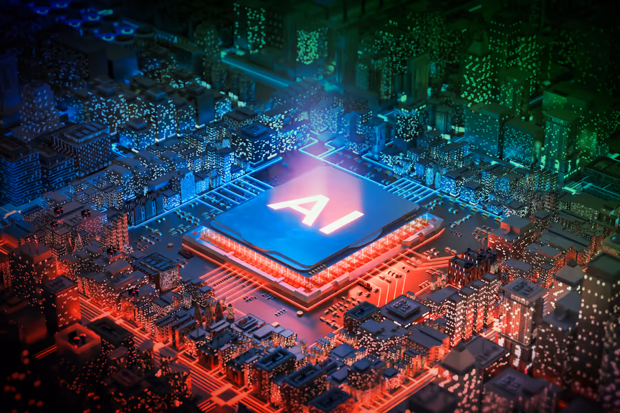 Inside of a computer looks like a metropolis. A circuit chip says “AI” and there are green and red parts of the city.