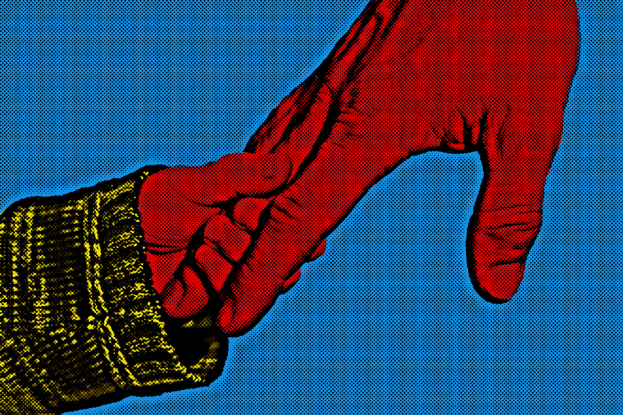child's hand in adult's