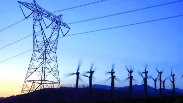This file photo dated 05 May, 2001 shows high tension power lines and wind turbines at the San Gorgonio Pass near Palm Springs, California, where consistently strong winds power thousands of windmill-driven electric generators.
