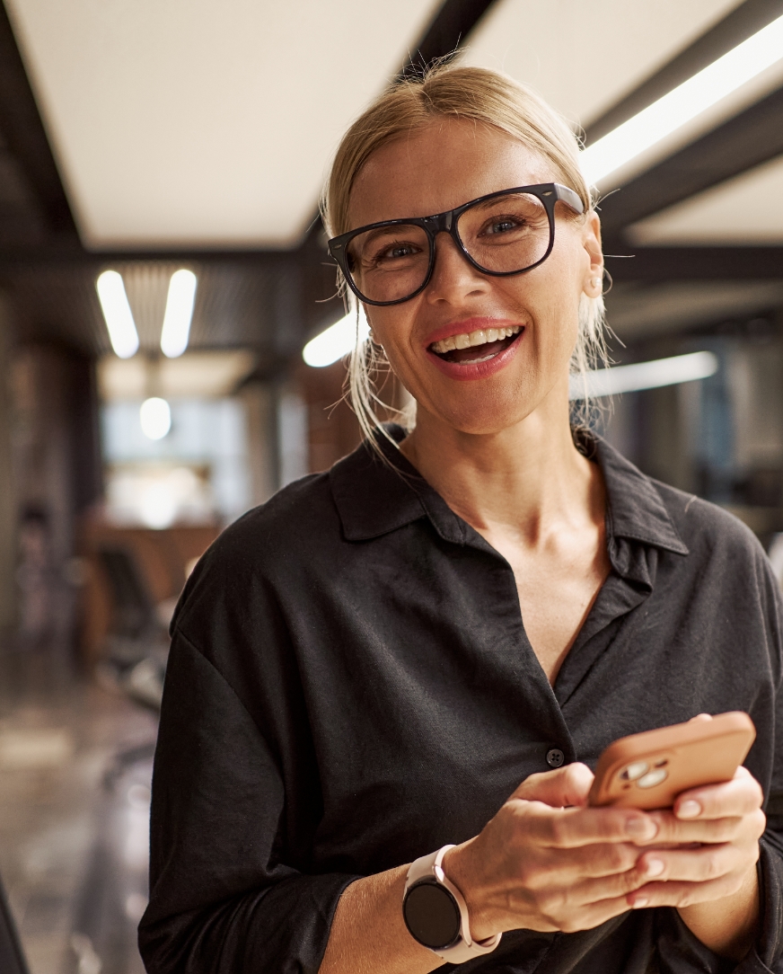 A happy founder using mobile phone