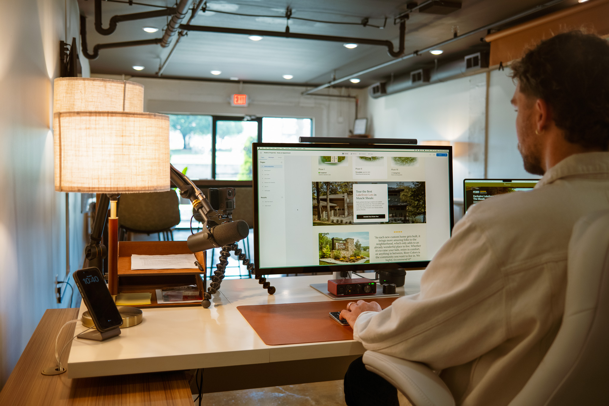 Austin Burleson designing websites at Cene office for web membership clients