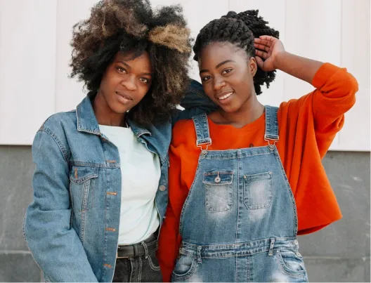 Two young people posing for camera