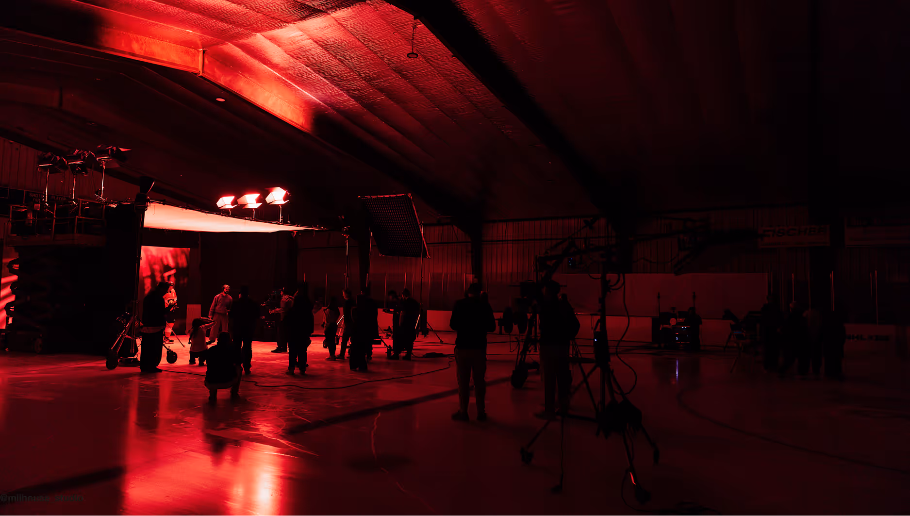 Milhouse Studio production set with crew filming under red lighting