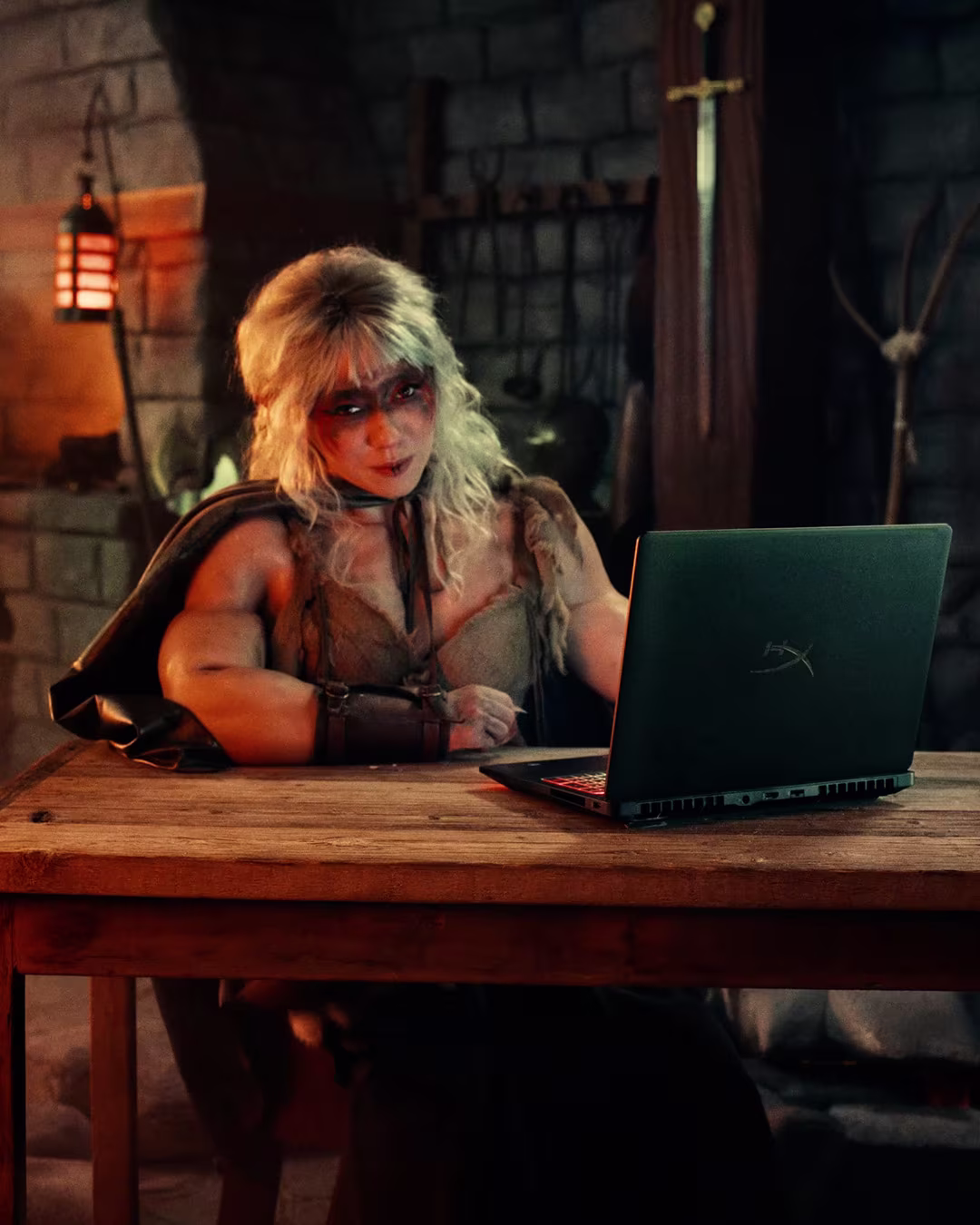 HyperX OMEN MAX 16 campaign — cosplay creator with a gaming laptop in a fantasy-themed set