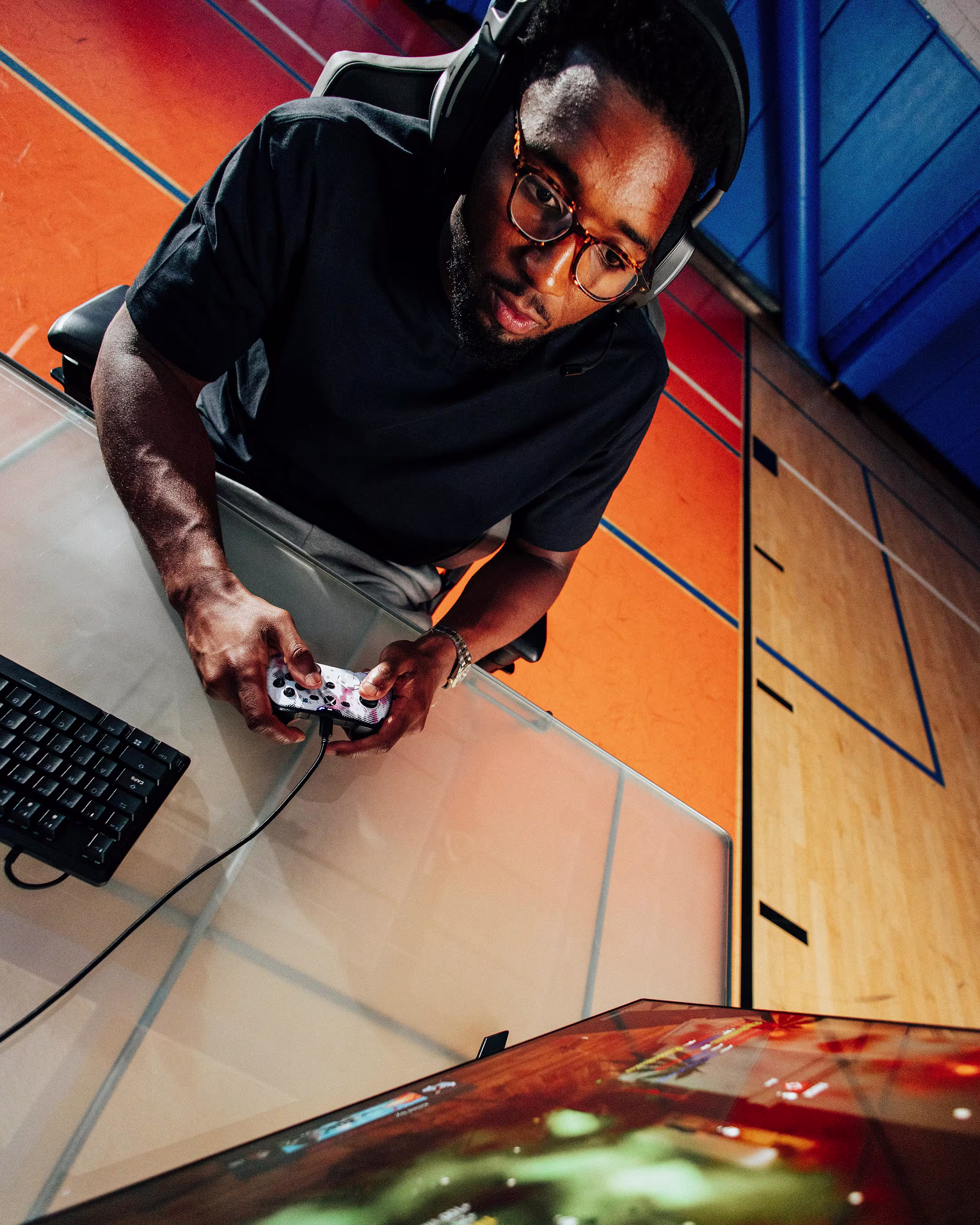 SCUF Gaming Donovan Mitchell campaign — gamer using a SCUF controller, overhead view