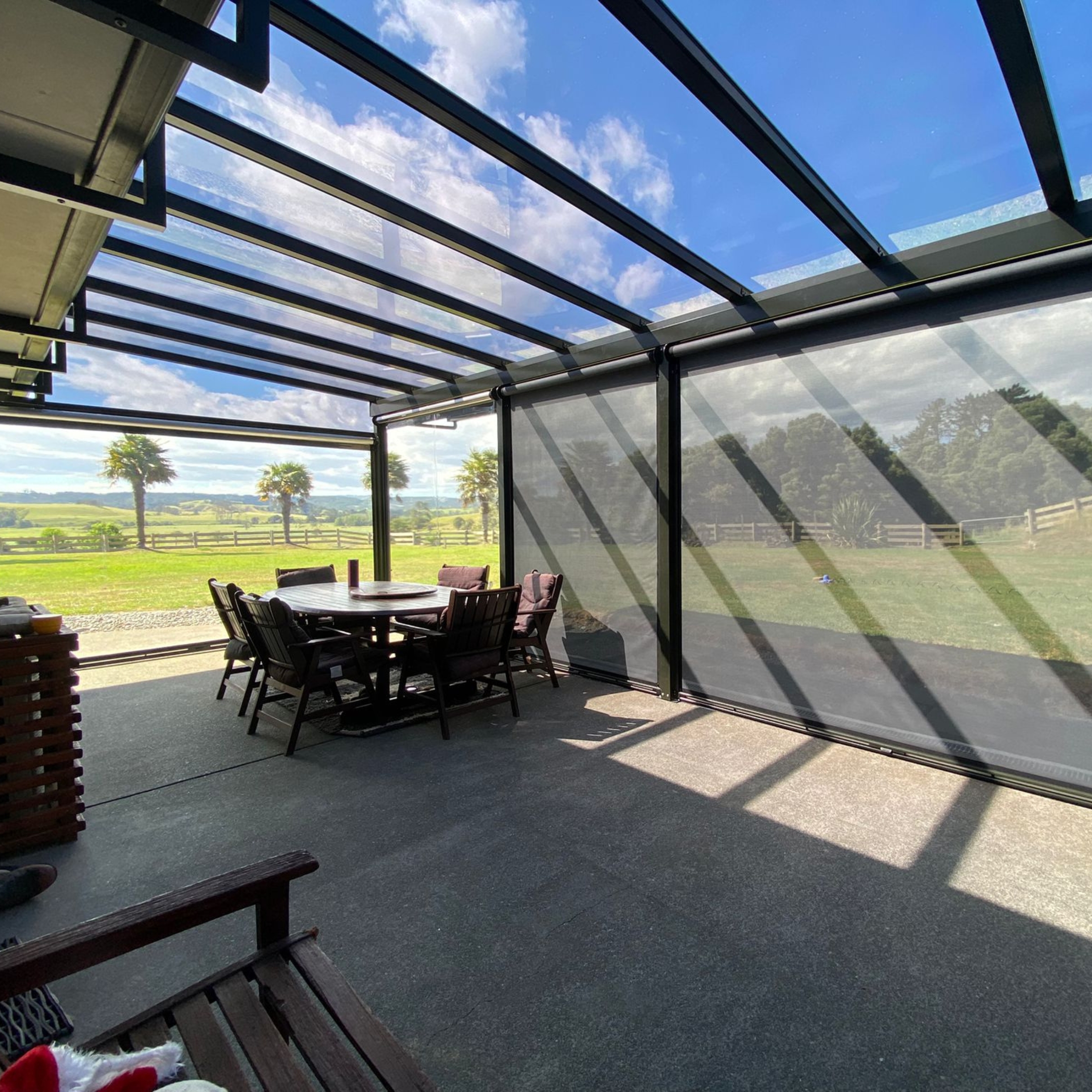Custom outdoor roof creating a sheltered outdoor room in Whananaki, by Shadeland