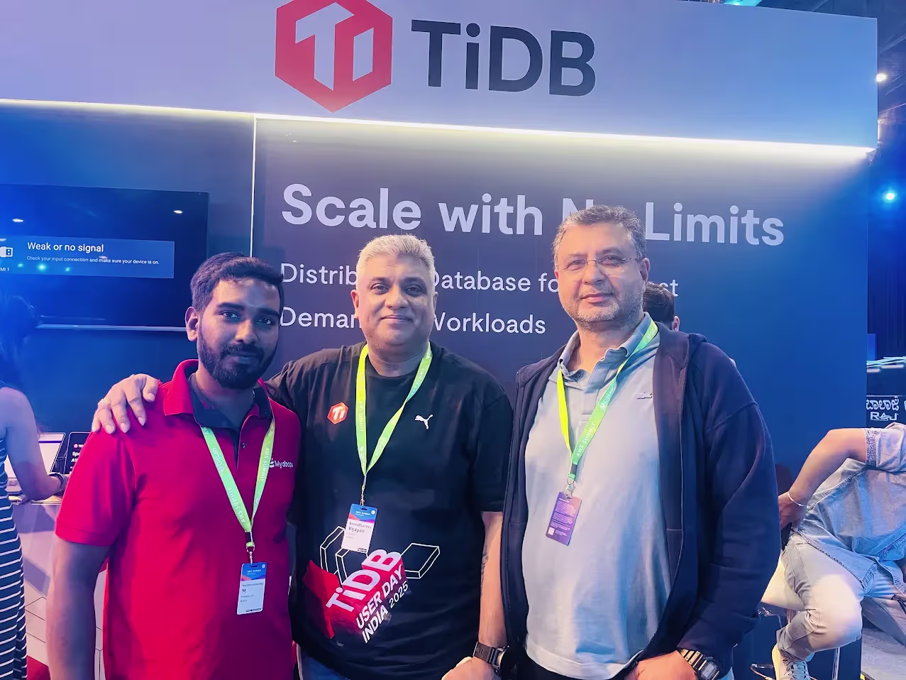 Four Mydbops engineers at TiDB booth at AWS Summit Bengaluru